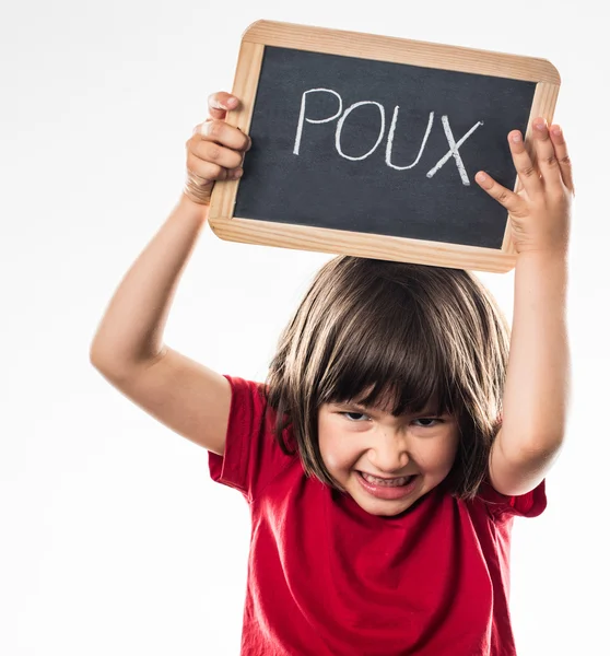 enraged kid holding school slate with \'poux\' written in French