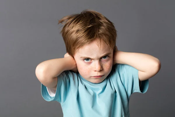 Stubborn kid with an attitude ignoring parents scolding, blocking ears — Stock Photo, Image