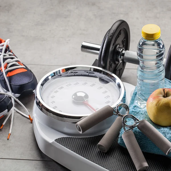 Scales, sneakers, weight exercise accessories and natural diet food — Stock Photo, Image