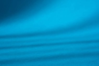 Creating a calming visual effect. This serene image showcases a smooth. Flowing texture in vibrant shades of blue.