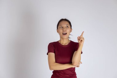 Female model showing idea or direction on white background.