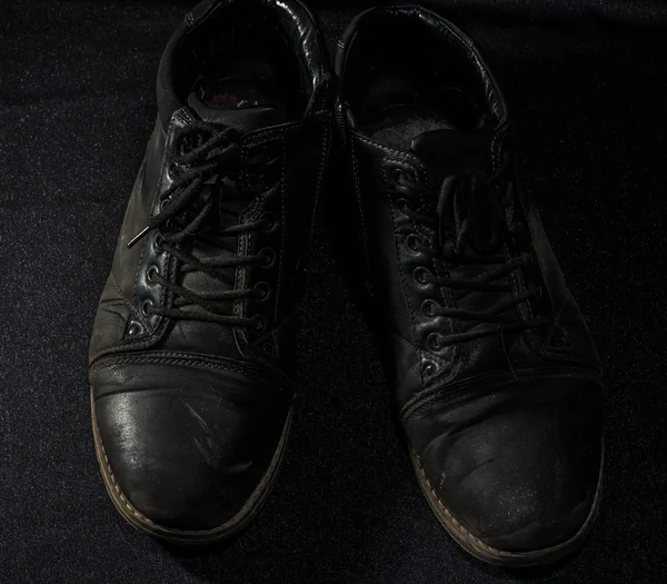 arka plan üzerinde ayakkabı yıpranmış eski