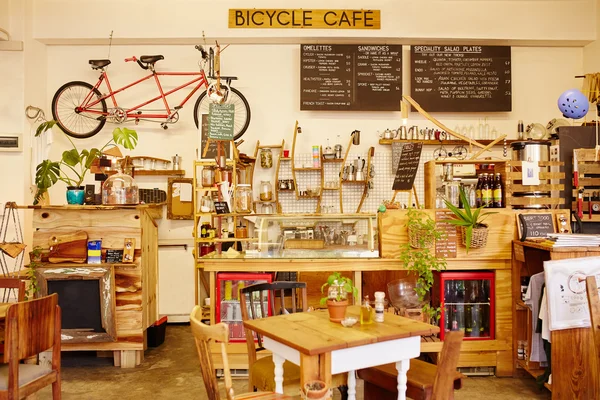 Coffee shop with bicycle on wall interior — Stock Photo, Image