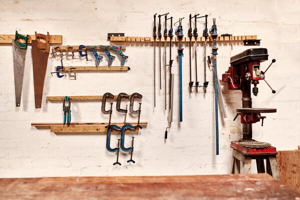 wall of woodwork workshop with hand tools