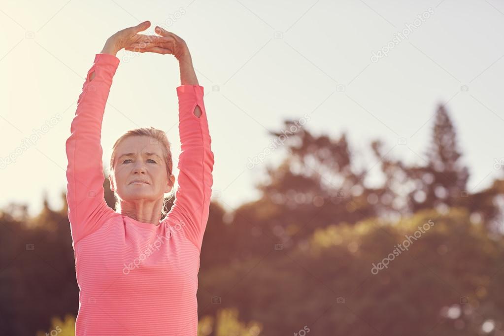 Sporty senior woman doing exercise