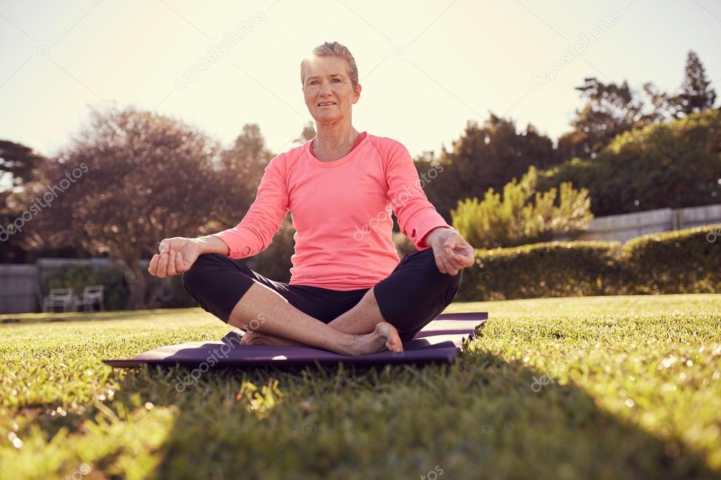 woman doing yoga breathing exercises
