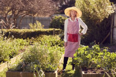 woman standing in urban food garden