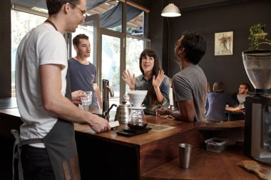 woman talking with colleagues and gesturing with hands