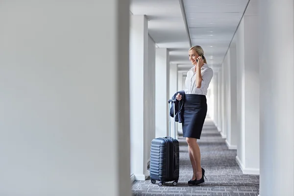 Businesswoman about to take business trip — Stock Photo, Image