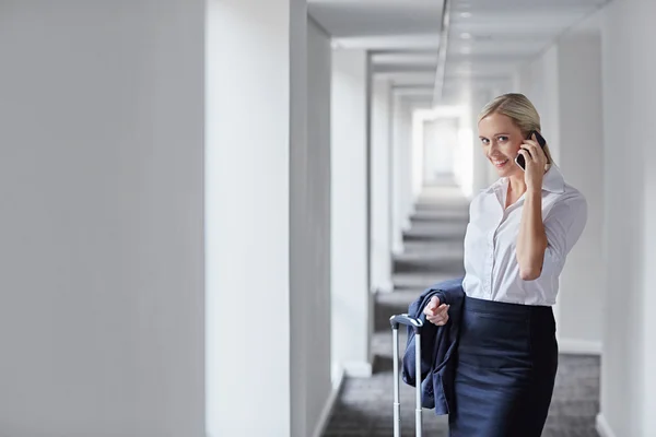 Businesswoman about to take business trip — Stock Photo, Image