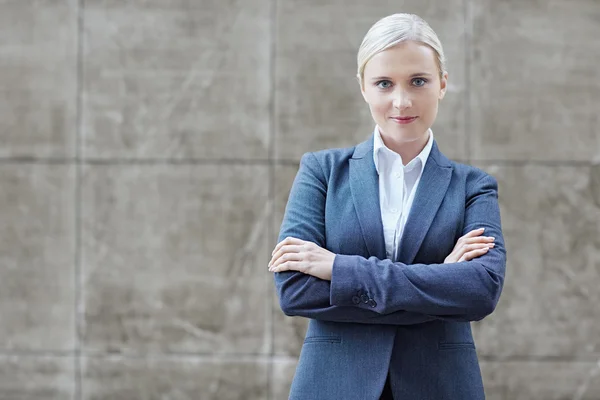 businesswoman with arms folded
