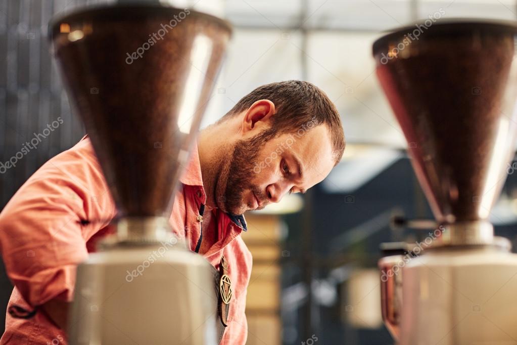 Man working in coffee roastery Stock Photo by ©mavoimages 105258686