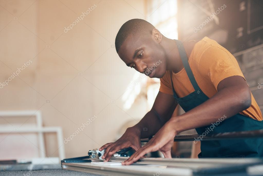 African craftsman using cutting tool — Stock Photo © mavoimages 109403716