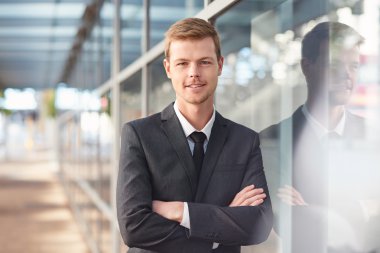 businessman standing with arms crossed clipart