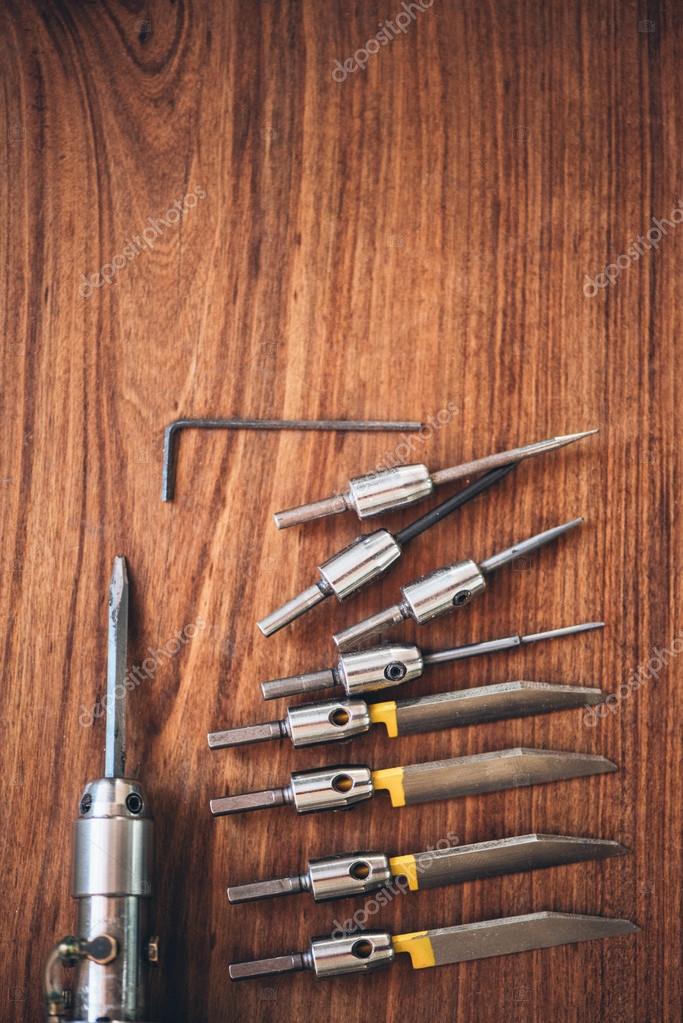 Hand engraving tools placing on table Stock Photo by ©mavoimages