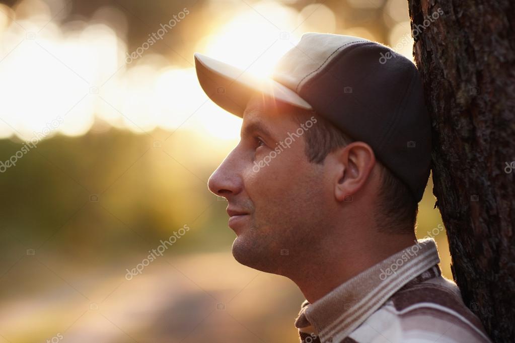 man looking away meditatively