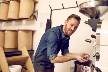 coffee roaster checking for quality of beans clipart