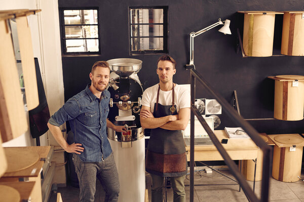 men in roast coffee beans workspace