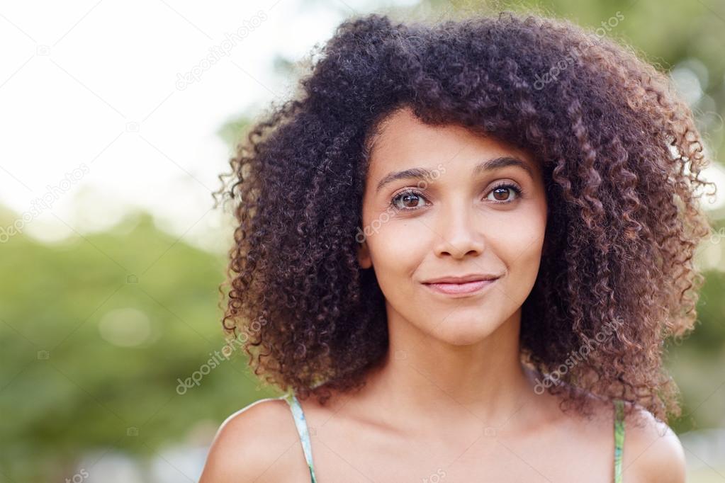 Beautiful woman smiling sweetly in park