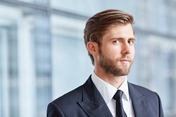 Businessman looking positively at camera — Stock Photo, Image