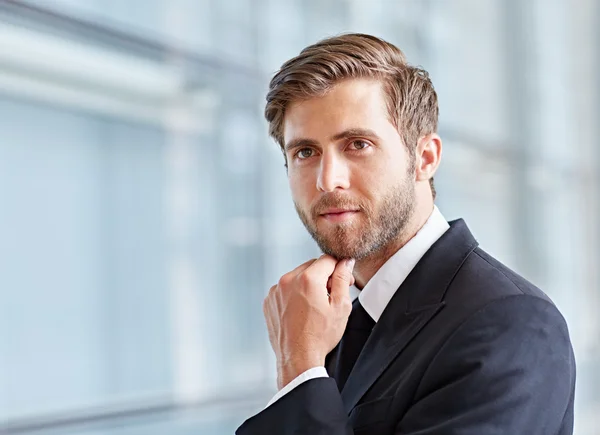 Corporate executive looking thoughtfully — Stock Photo, Image