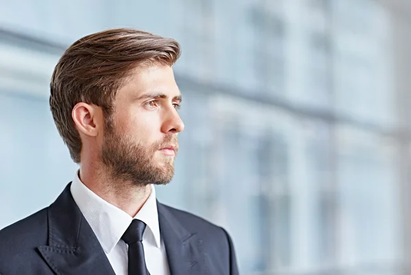 Businessman looking up thoughtfully and confidently — Stock Photo, Image