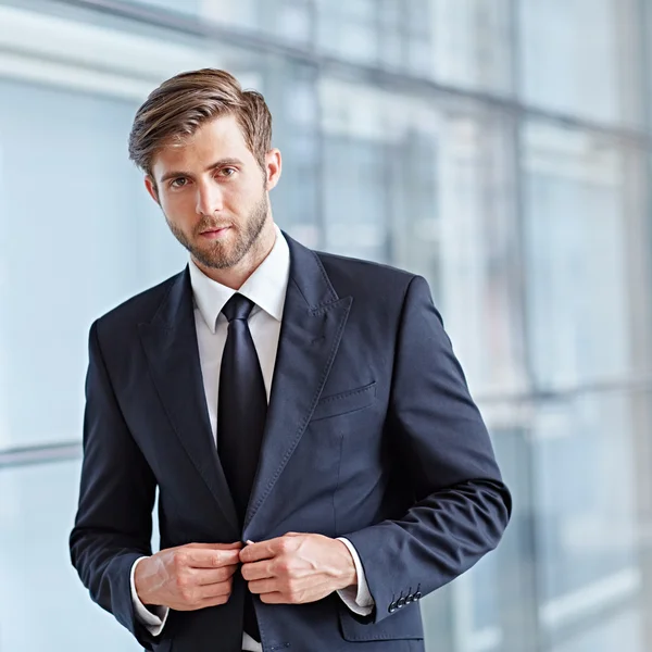 Businessman looking positively at camera — Stock Photo, Image