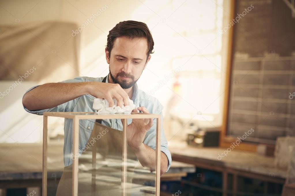 Designer finishing his woodwork project