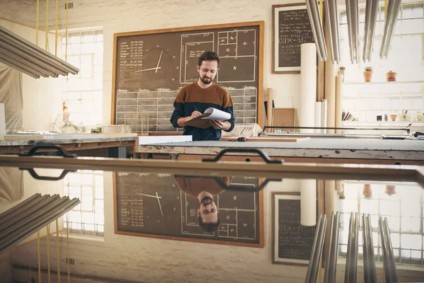 Designer checking stock in studio — Stock Photo, Image