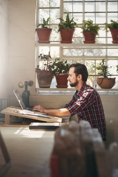 Entrepreneur working in office space — Stock Photo, Image