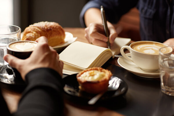 Interview in cafe with coffee and pastry