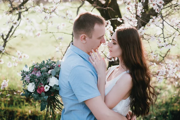 Young couple in love outdoor on blue sky background. — Stockfoto