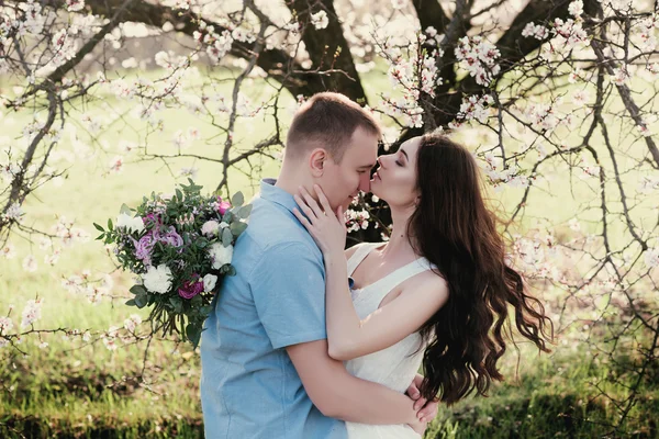 Young couple in love outdoor on blue sky background. — Stockfoto