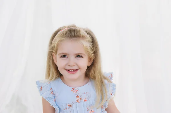 Portrait of a little girl smiling blonde — Stock Photo, Image