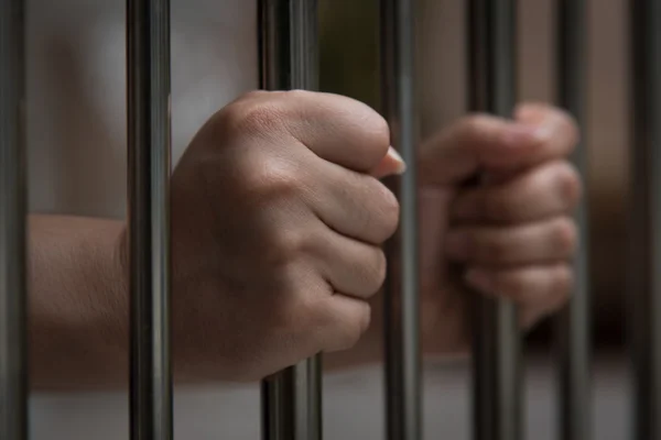 Hand in jail — Stock Photo, Image