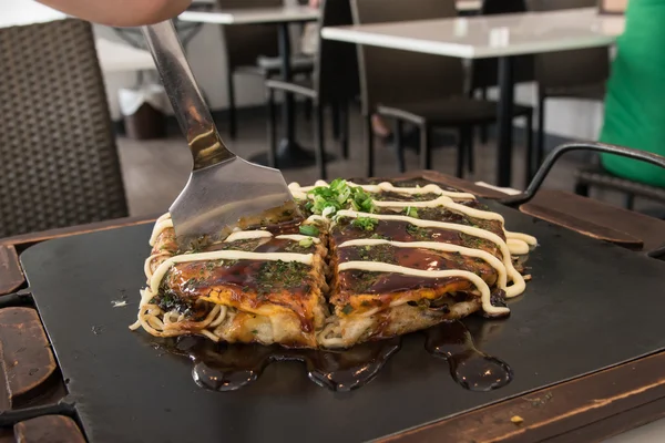 stock image Okonomiyaki  on iron plate