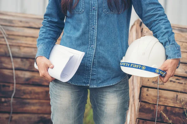 Woman construction engineer wear safety white hard hat at construction site industry worker. Female engineer worker civil engineering with hard hat safety helmet. Woman construction Engineer concept