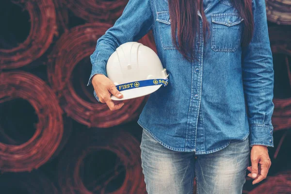 Woman construction engineer wear safety white hard hat at construction site industry worker. Female engineer worker civil engineering with hard hat safety helmet. Woman construction Engineer concept