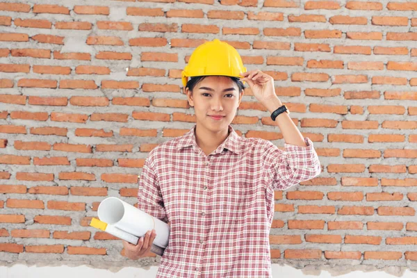 Woman construction engineer wear safety white hard hat at construction site industry worker. Female engineer worker civil engineering with hard hat safety helmet. Woman construction Engineer concept