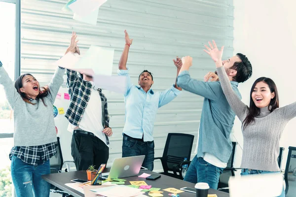 Group of business people finish job done throwing paper work and dance with happiness. Diversity people dance, fun, joy, happy promotion  employment having good news. Man look at camera dancing happy