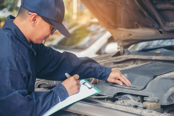 Mechanic car service auto garage in automotive mobile center. Technician workshop repair engine motor vehicles service mechanical engineering business. Automobile mechanic hands car repairs technic