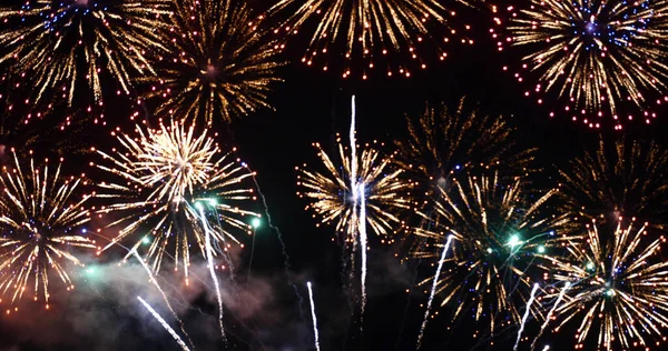 Colorful vibrant Firework celebrate anniversary happy new year 2022, 4th of july holiday festival. colorful firework in the night time to celebrate national holiday. countdown new year 2022 party time