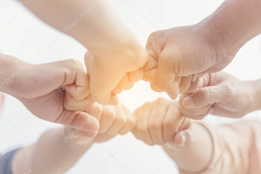 Close up hands Diverse multiethnic Partners team together. Teamwork group of multi racial people meeting join hands. Diversity people hands join empower partnership teams connect volunteer community