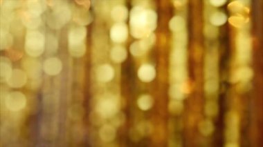 Abstract gold background with glitter particles.