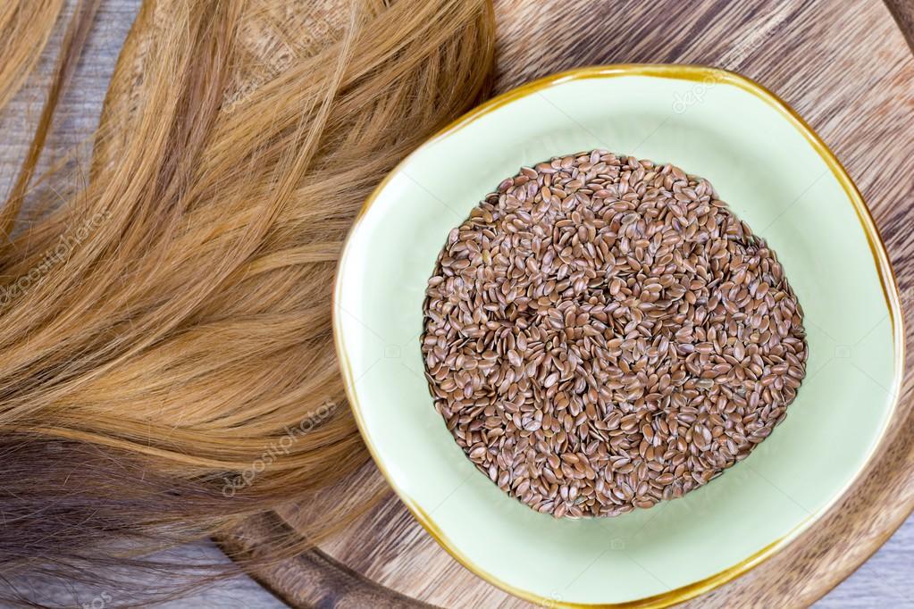 Flaxseeds with blonde hair Stock Photo by © 95268024 Flaxseeds with blonde hair Stock Photo by © 95268024