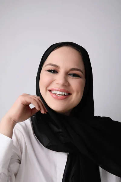 Vertical portrait of happy muslim woman wears black hijab.Isolated. — Stock Photo, Image