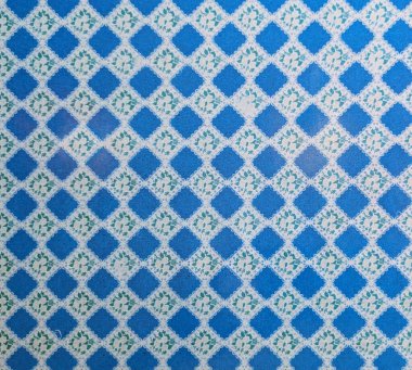 Küçük Yeşil Çiçek Motifleri (Tekstil Arkaplanı) ile Canlı Mavi ve Beyaz Geometrik Desen)