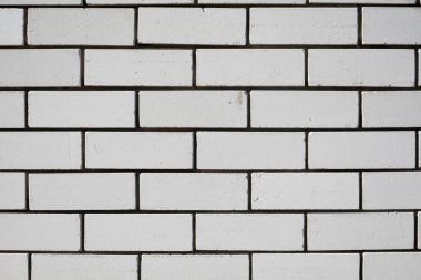 Parlak yüzeyi ve geometrik dikdörtgen desenli beyaz metro fayans duvarı