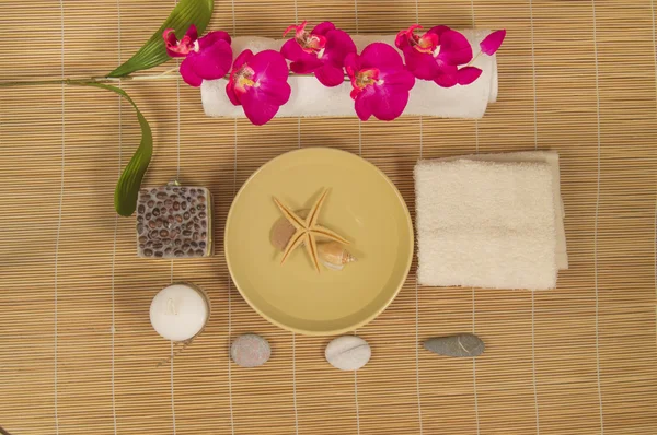 Spa and Wellness setting with natural accessories  Stones, towel, Orchid — Stock Photo, Image