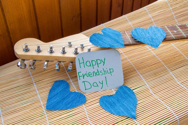 Happy Friendship day 4 Aug. Heart of denim on the guitar — Stock Photo, Image